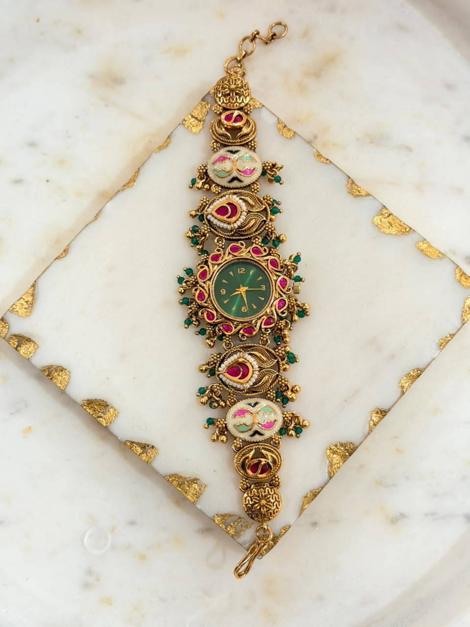 Traditional Gold Tone Elephant Bracelet Watch with Red Green Stones and Floral Work